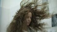 woman with hair blowing in wind